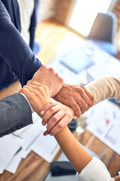 image of people holding hands.